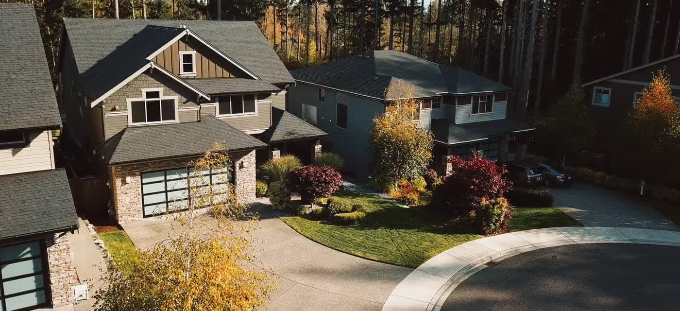 Aerial view of houses on a treed residential street